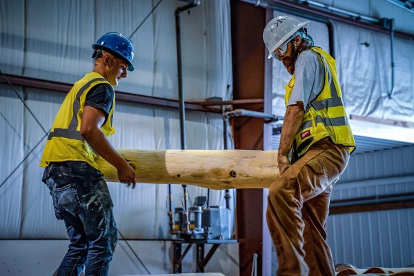 Endowment WholeTrees image of two men working with tree wood