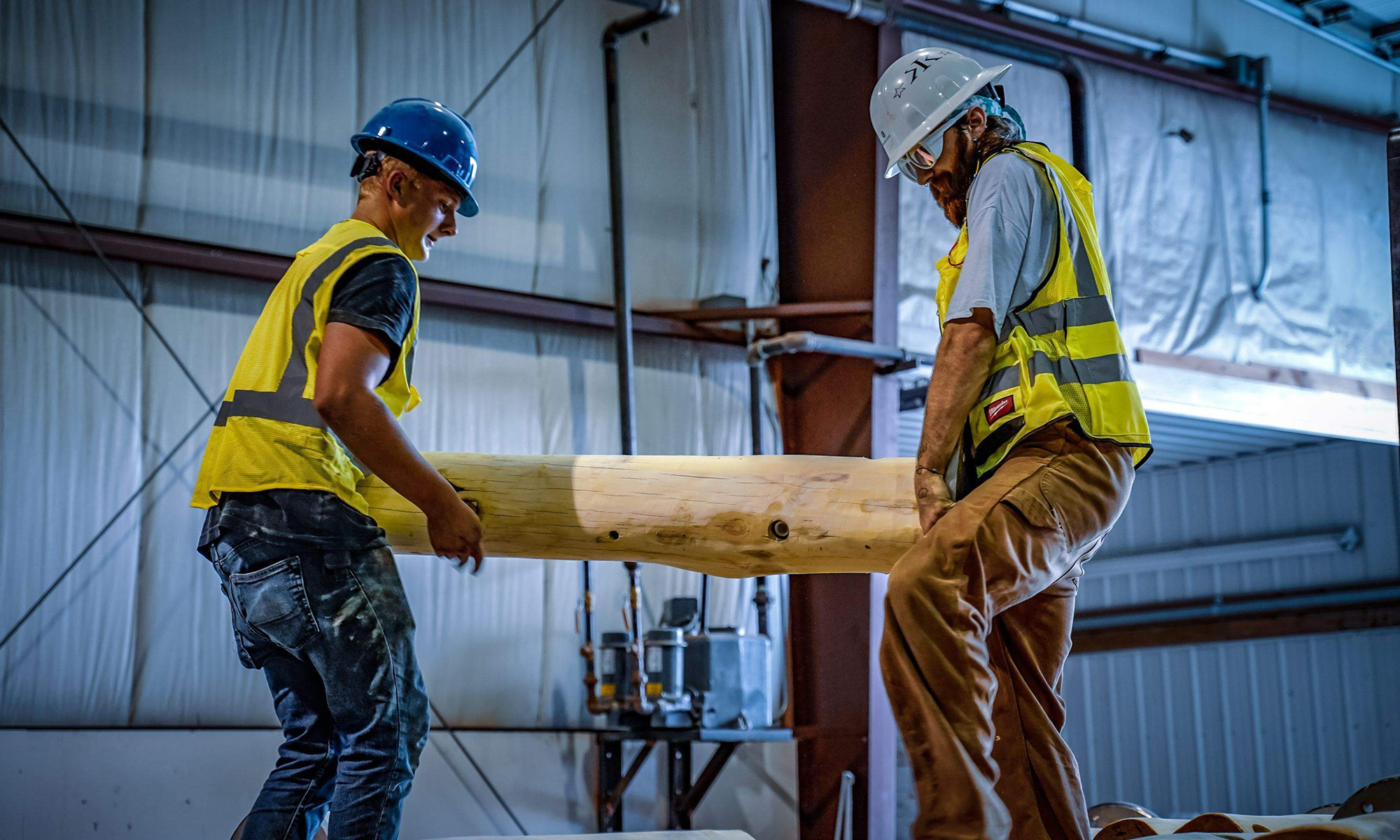 Endowment WholeTrees image of two men working with tree wood